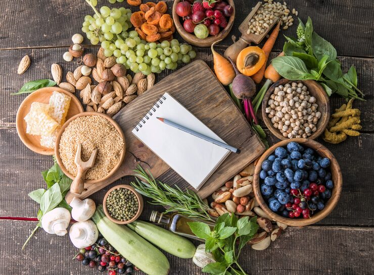 Bright wholesome ingredients arranged on a timber table for Purgingypurify mindful meals chapter